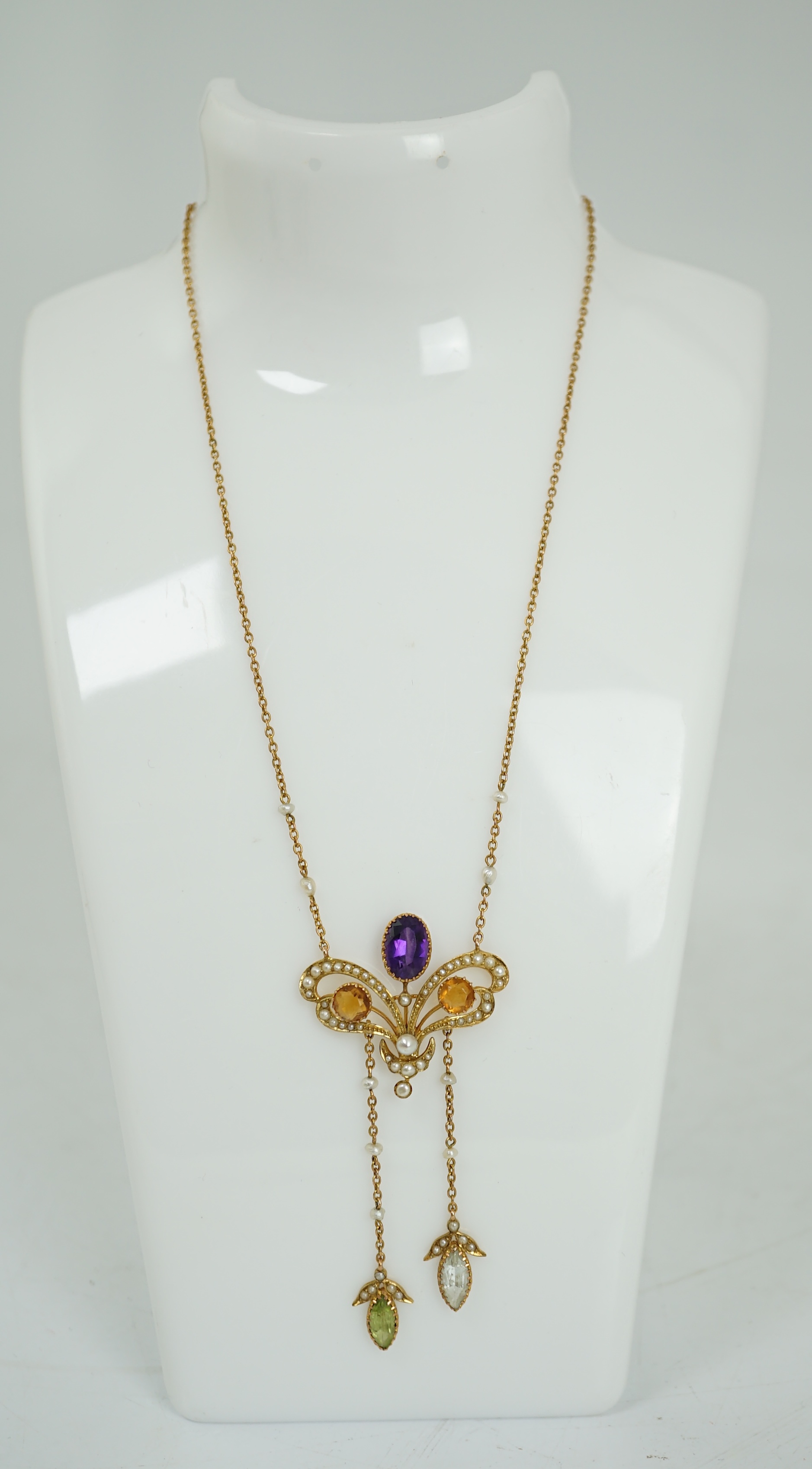 An Edwardian yellow metal, seed pearl and multi gem set double drop pendant necklace